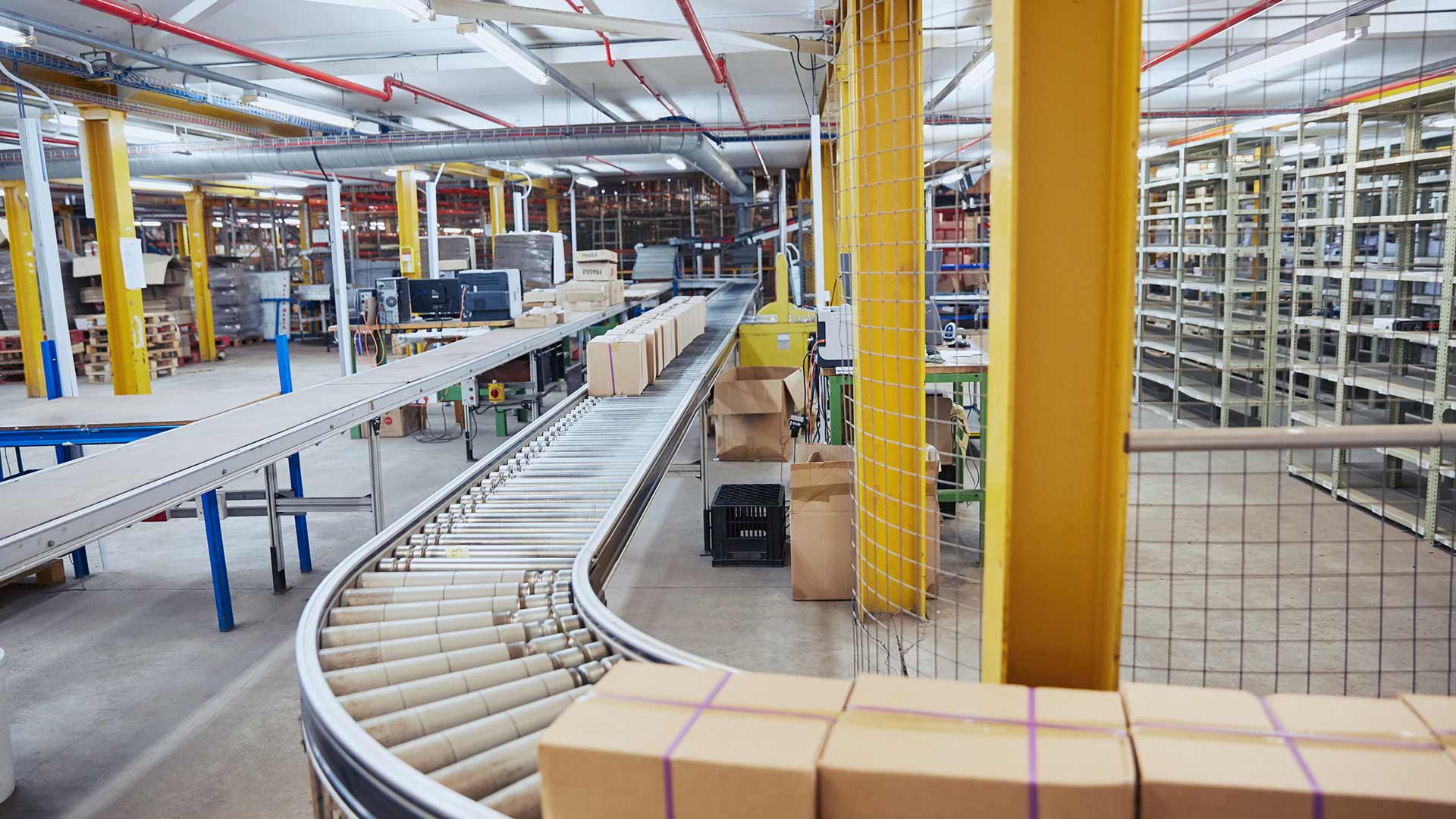 Scanning box on conveyor belt in distribution warehouse