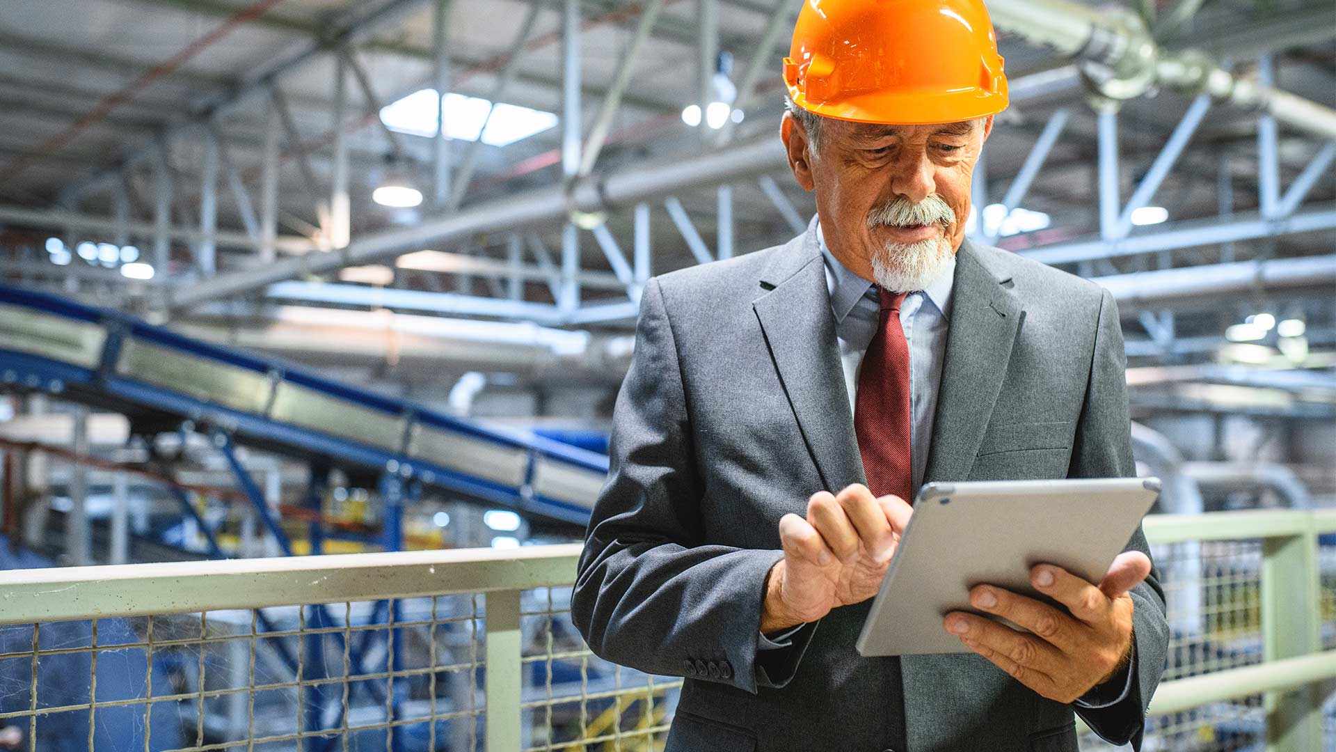 manager with tablet in factory