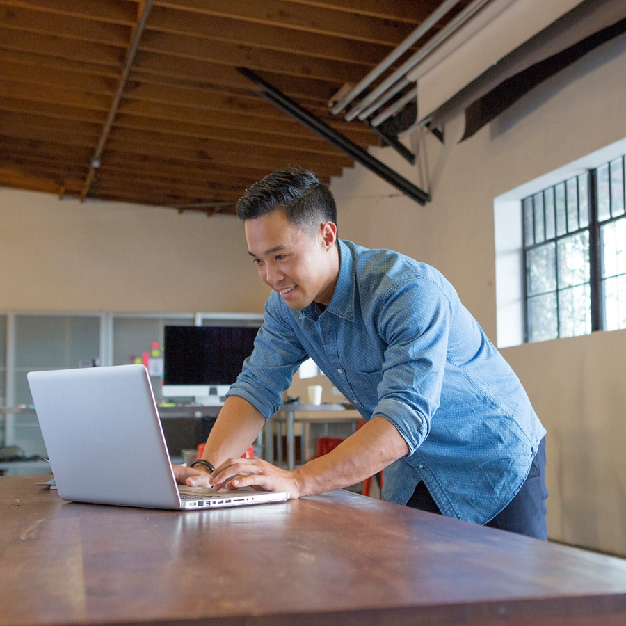 IT expert working on a laptop