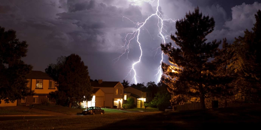 Lightning bolt and thunderhead storms over Denver neighborhood