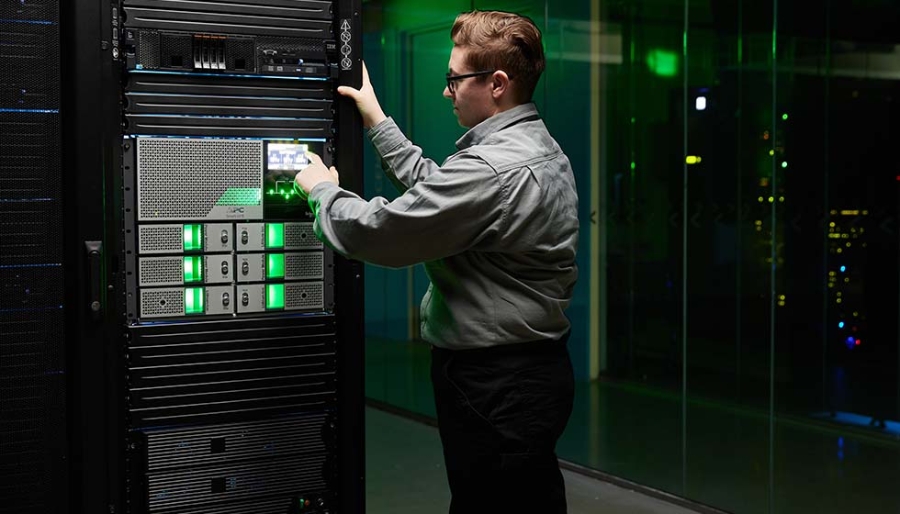 A Schneider Electric Field Service Rep checking the status of a Smart-UPS