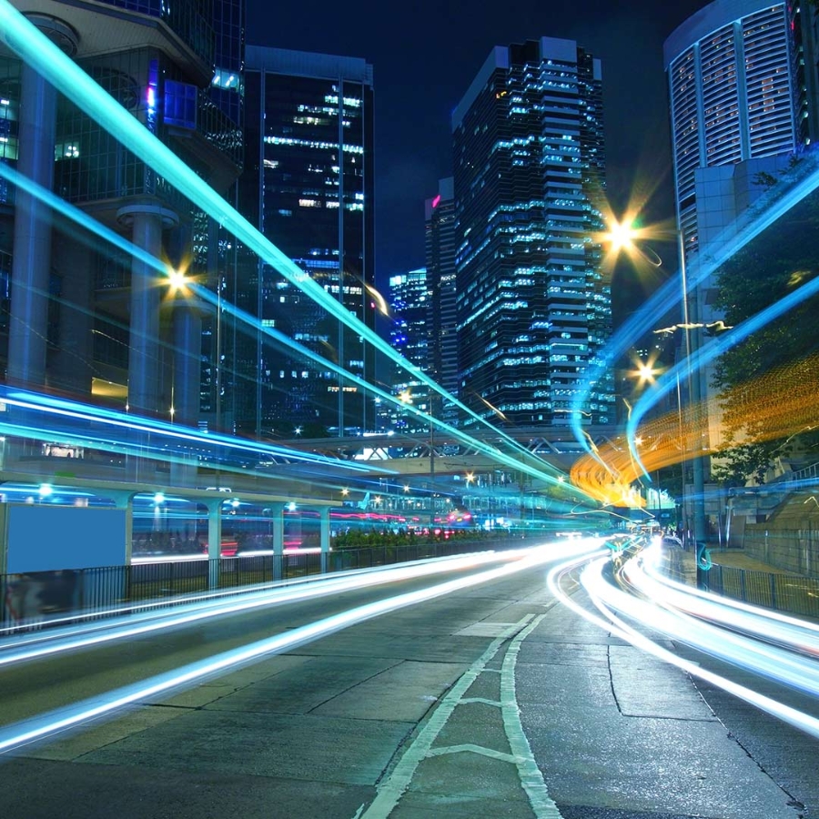 Trail of vehicle lights on a street of city at night